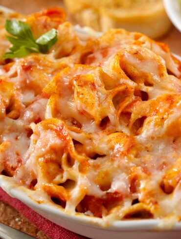 Close up image of Baked Tortellini in a baking dish