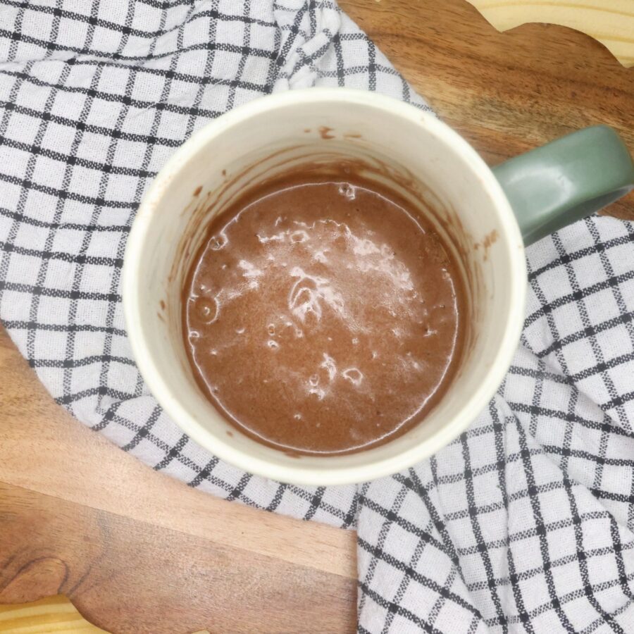 A coffee mug with brownie mix in it