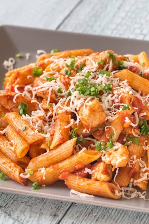 Close up image of Chicken Penne Pasta on a square plate