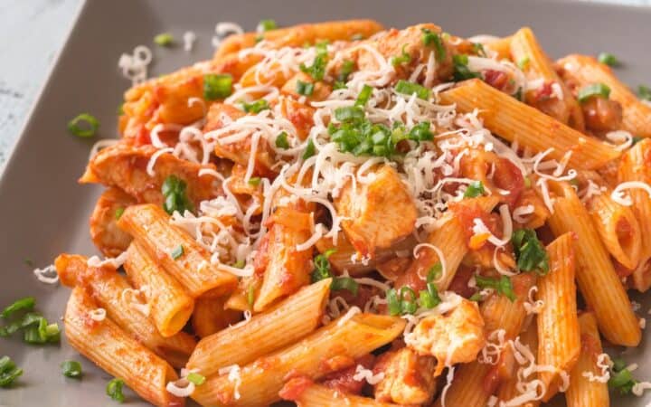 Close up image of Chicken Penne Pasta on a square plate