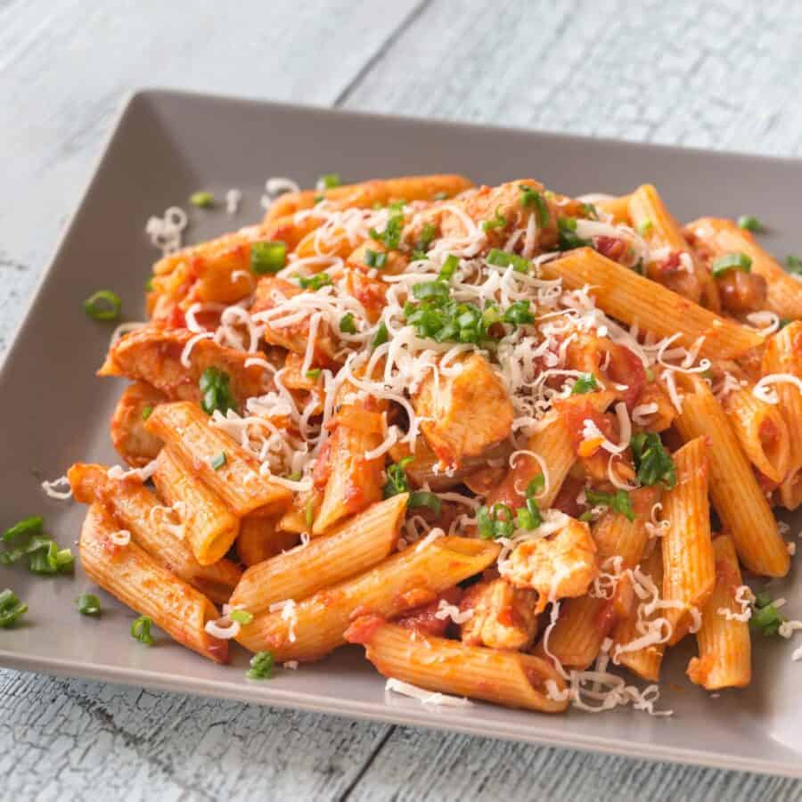 Close up image of Chicken Penne Pasta on a square plate