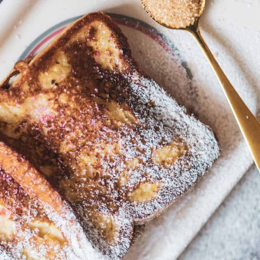 Close up image of Cinnamon French Toast on a plate sprinkled with powdered sugar