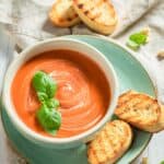 Overhead image of Creamy Tomato Soup in a bowl with toasted bread