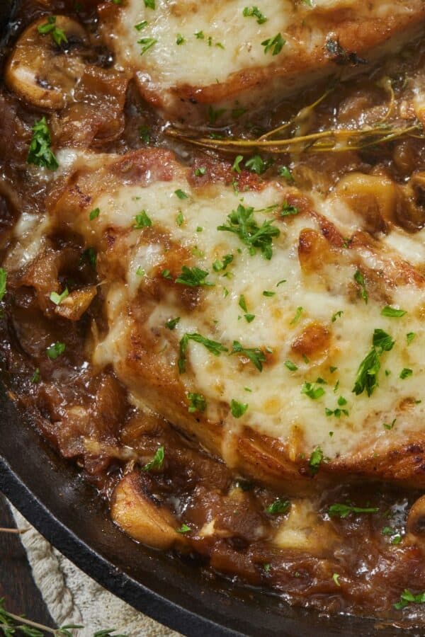 Close up image of French Onion Pork Chops in a skillet