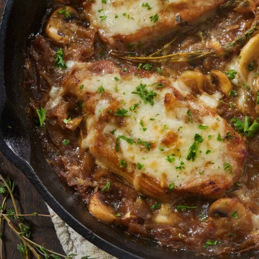 Close up image of French Onion Pork Chops in a skillet