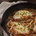 Overhead image of French onion pork chops in a skillet - 9