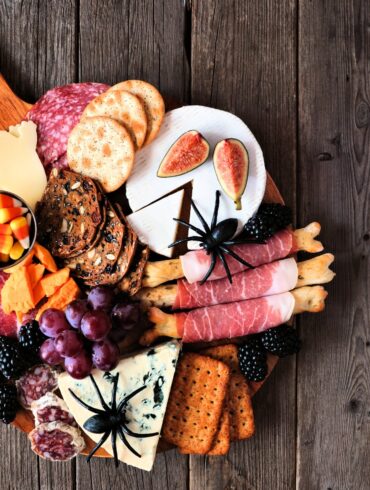 Overhead image of a Halloween Charcuterie Board on a wooden background