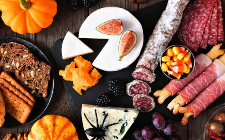 Items for a Halloween Charcuterie Board grouped on a wooden background