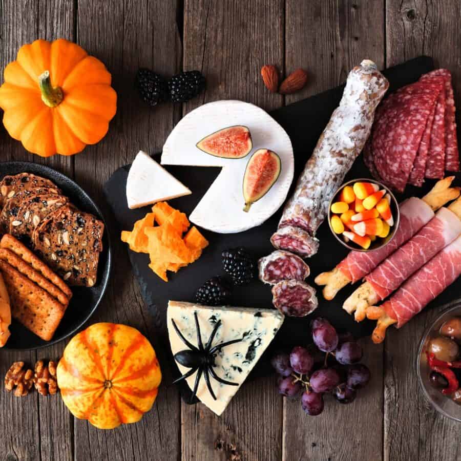 Items for a Halloween Charcuterie Board grouped on a wooden background