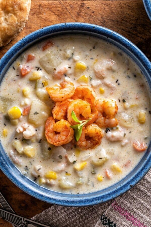 Overhead image of Shrimp and Corn Soup in a blue bowl