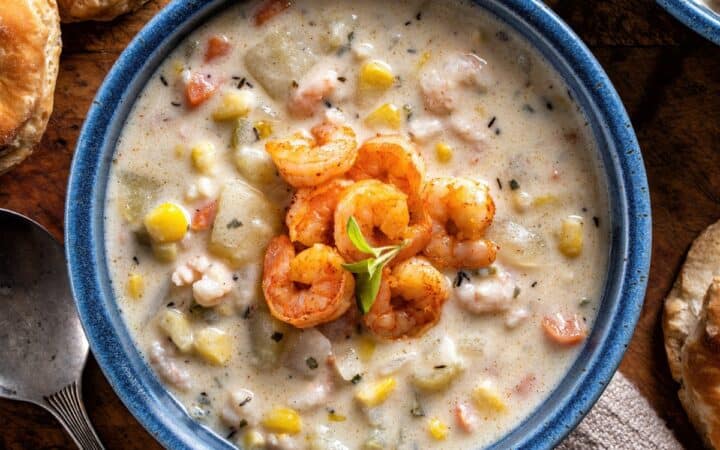 Overhead image of Shrimp and Corn Soup in a blue bowl