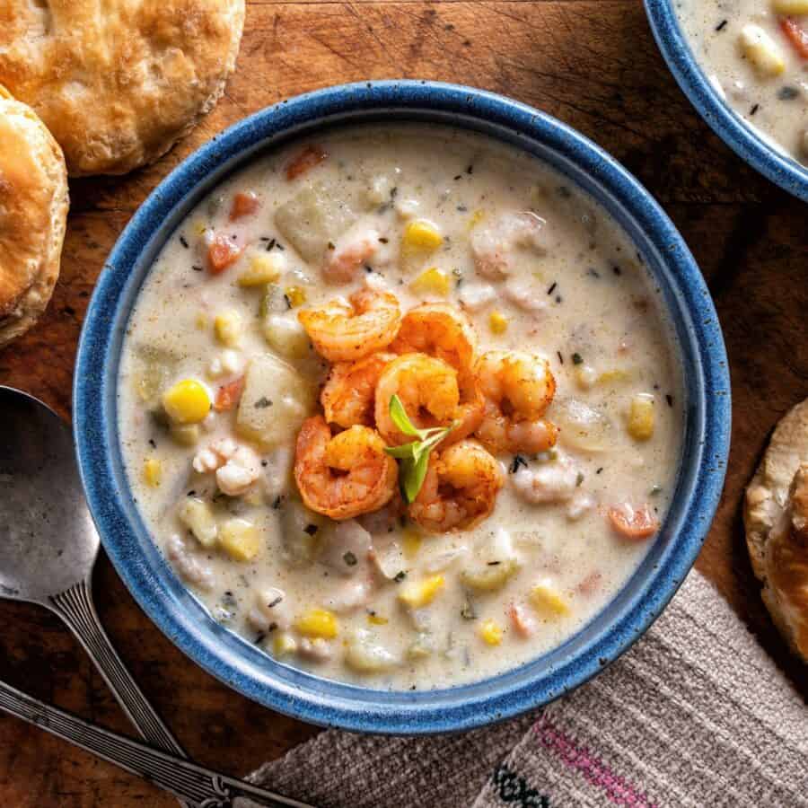 Overhead image of Shrimp and Corn Soup in a blue bowl