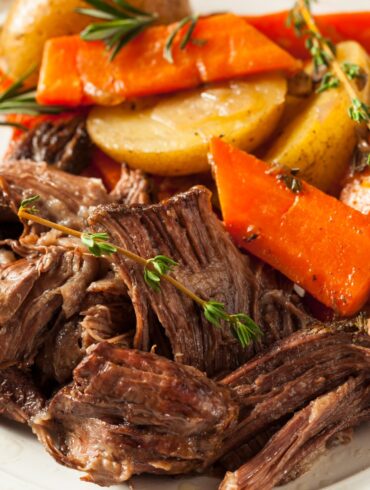 Slow Cooker Chuck Roast with potatoes and carrots on a serving platter