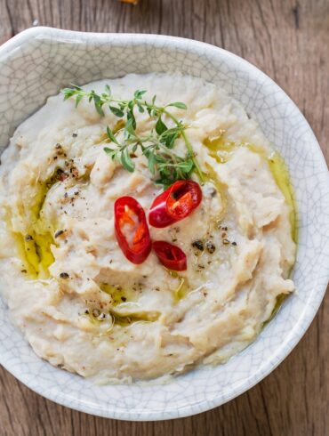 Overhead image of white bean dip in a bowl