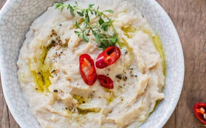 Overhead image of white bean dip in a bowl