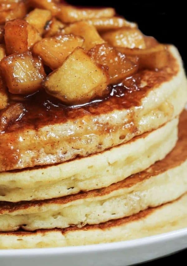 A stack of apple pie pancakes on a plate