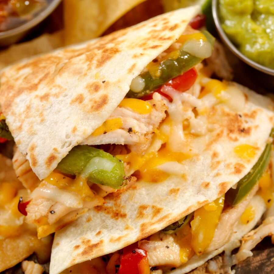 Close up image of a sliced chicken quesadilla