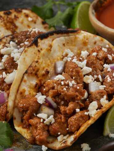 Chorizo Tacos on a plate with garnishes