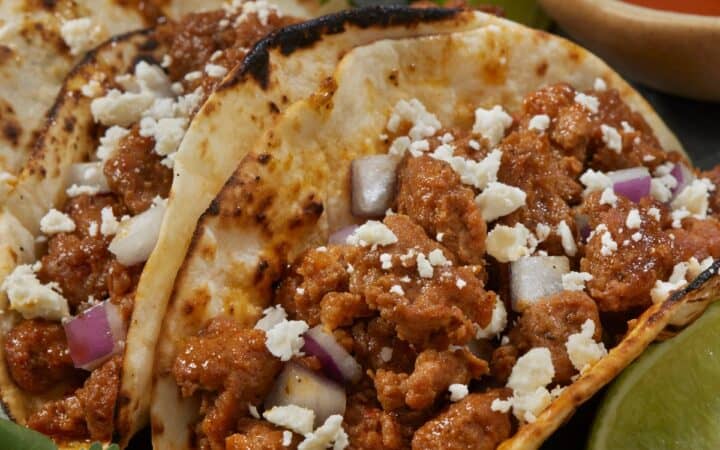 Chorizo Tacos on a plate with garnishes