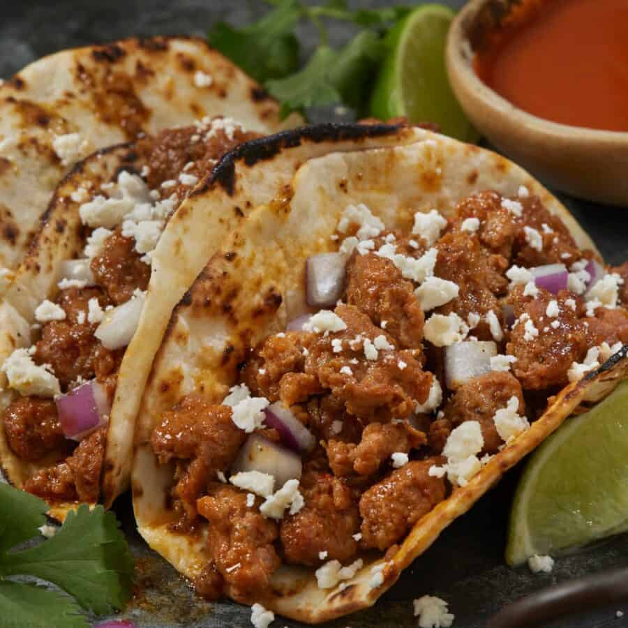 Chorizo Tacos on a plate with garnishes