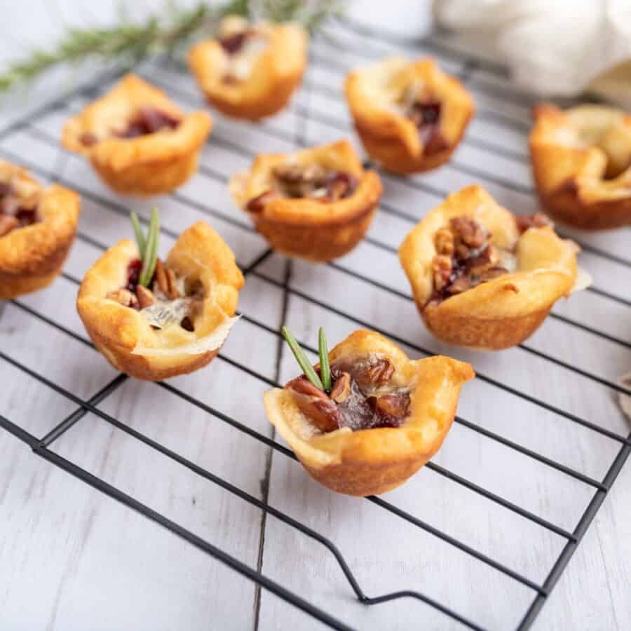 Cranberry Brie Bites cooling on a wire baking rack