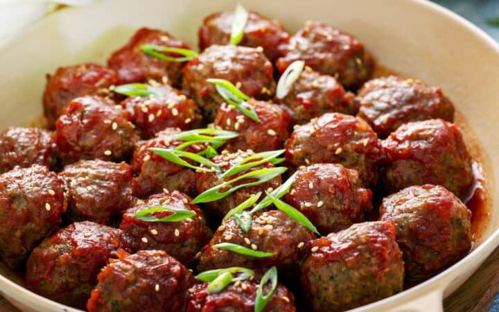 Korean Meatballs in a tan skillet with handles