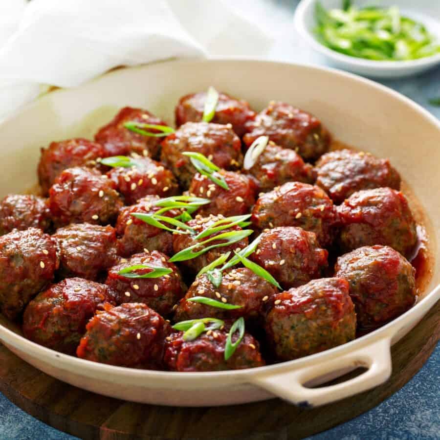 Korean Meatballs in a tan skillet with handles