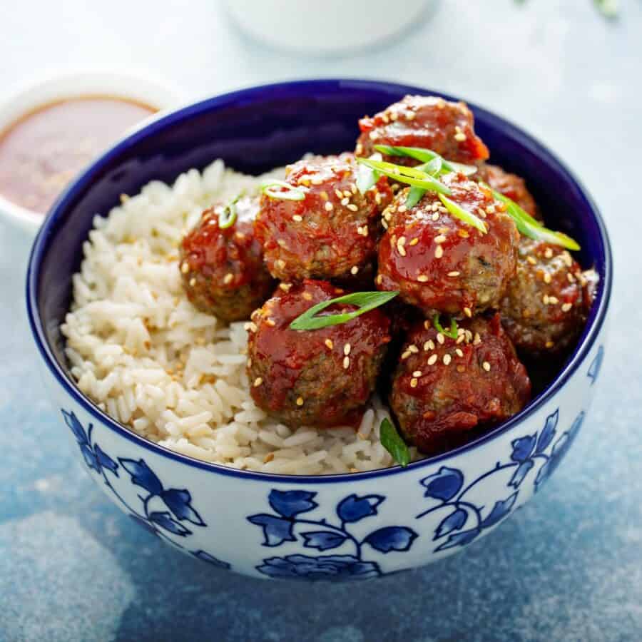 Korean Meatballs on a bed of rice in a decorative bowl
