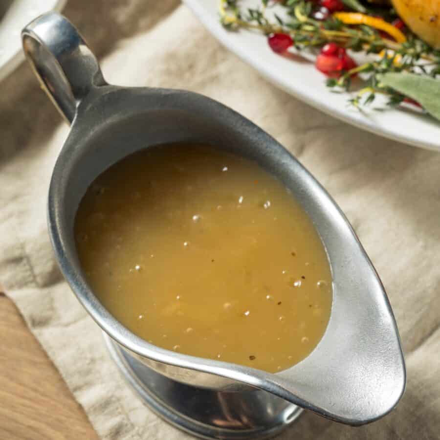 Close up image of Turkey Gravy in a metal gravy boat