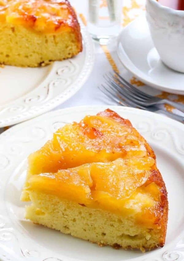 Two pieces of Apple Upside Down Cake on a white plate