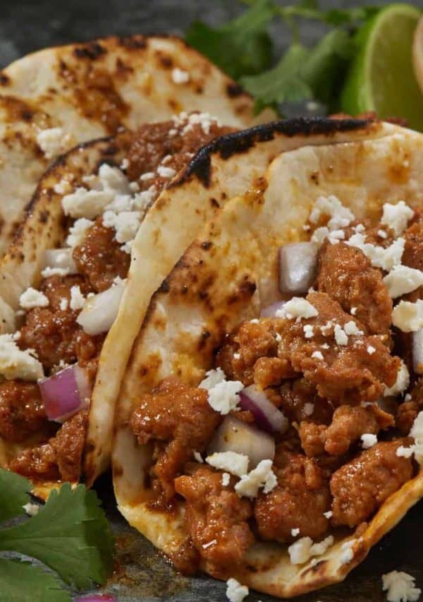 Chorizo Tacos on a plate with garnishes