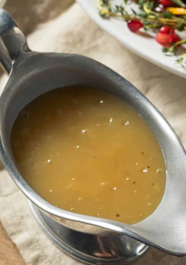 Close up image of Turkey Gravy in a metal gravy boat