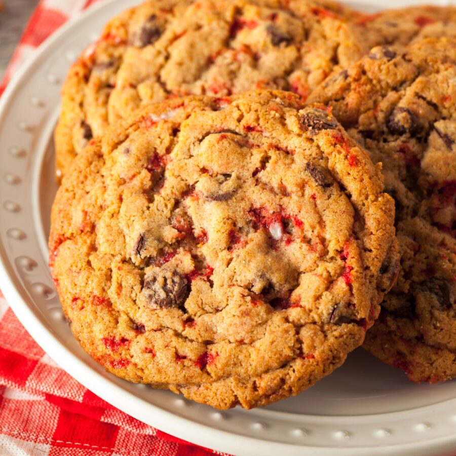 Close up image of peppermint chocolate chip cookies on a white plate