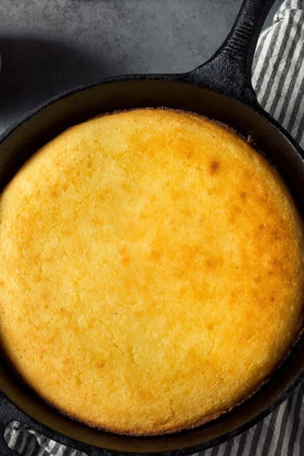 Overhead image of Skillet Cornbread on a decorative towel