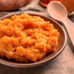 Close up image of mashed sweet potatoes in a bowl