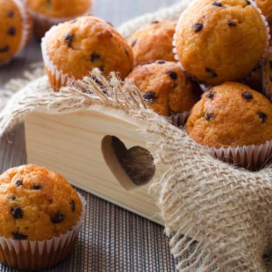 Mini Muffins with chocolate chips on a wooden tray with burlap