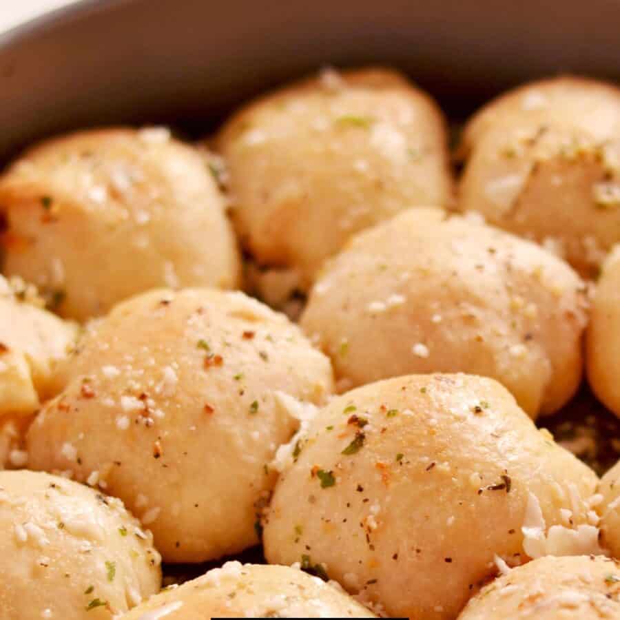 Close up image of baked pizza balls in a baking dish