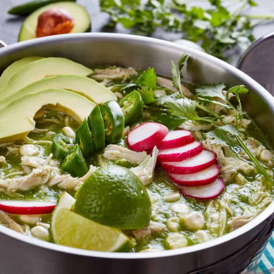 Close up image of Pozole Verde in a metal pot