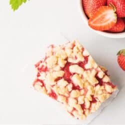 Overhead image of a strawberry shortcake bar on a white surface