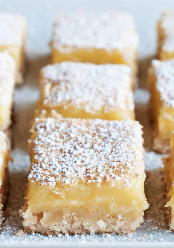 Close up image of Lemon Squares on a light surface