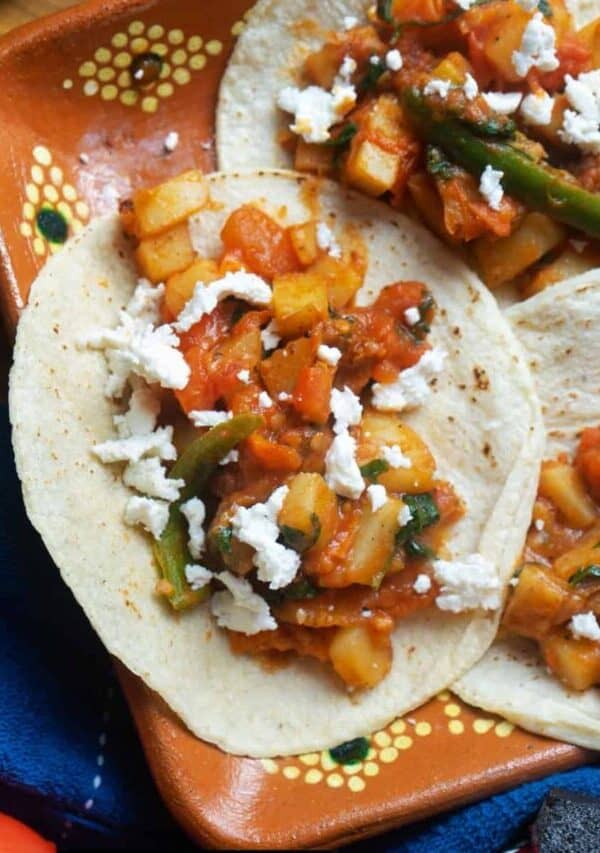 Three Potato Tacos on a decroative plate