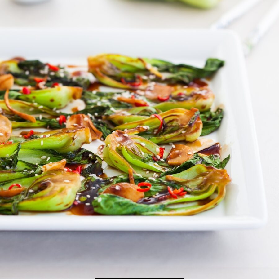 Close up image of Air Fryer Bok Choy on a white plate