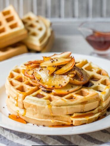 Buttermilk Waffles on a plate with sliced apples