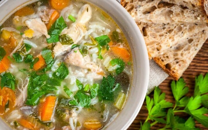 Overhead image of Feel Better Chicken Soup with a side of bread