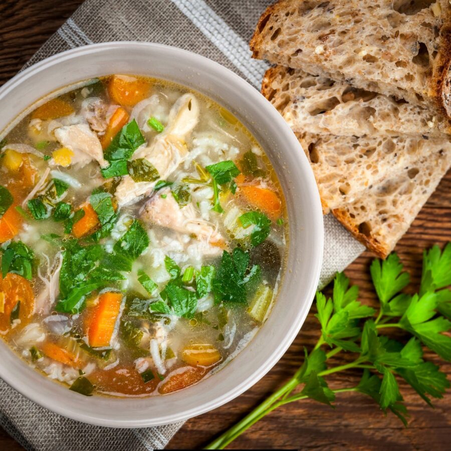 Overhead image of Feel Better Chicken Soup with a side of bread