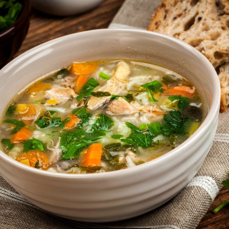 Close up image of Feel Better Chicken Soup in a white bowl