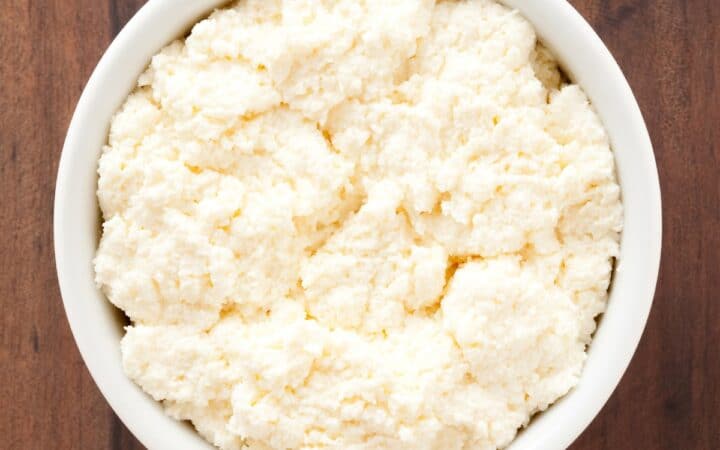 Overhead image of ricotta cheese in a white bowl