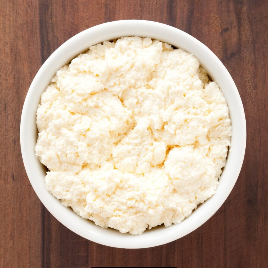 Overhead image of ricotta cheese in a white bowl