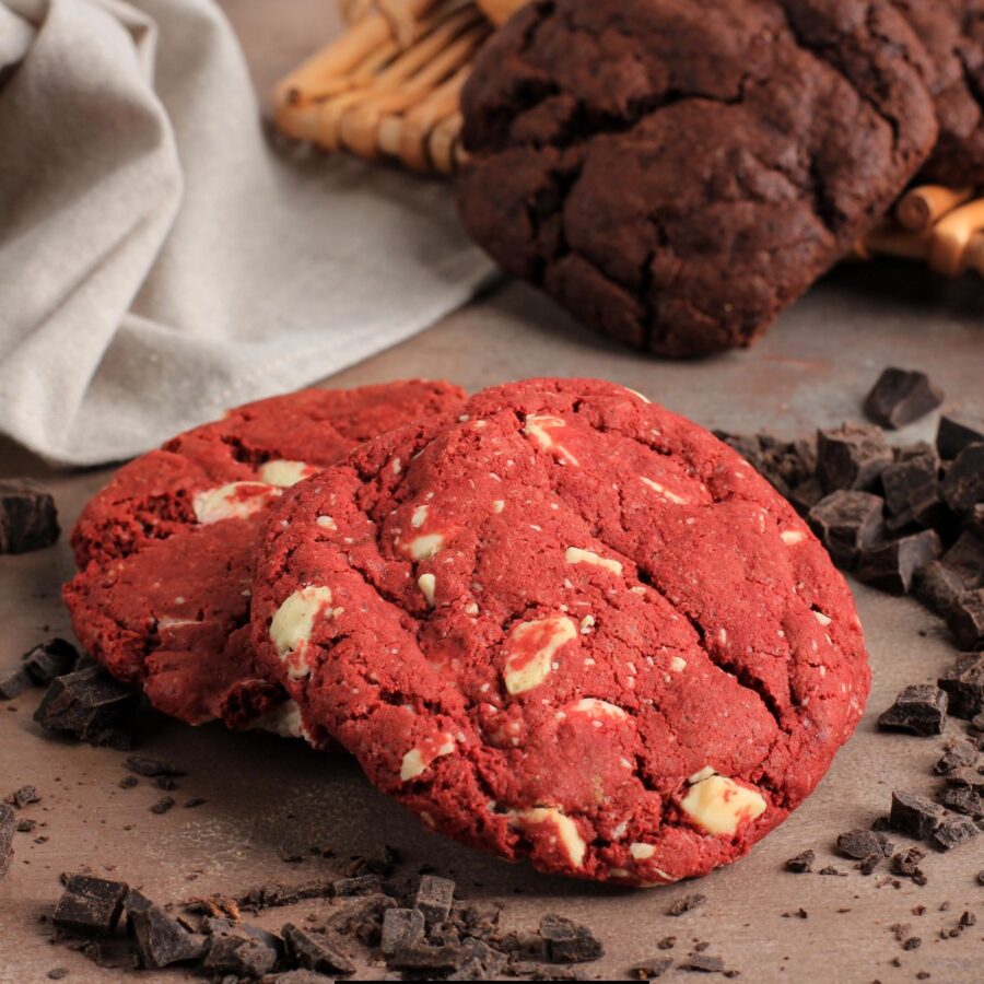 Red Velvet Cookies on a dark background with cacao nibs