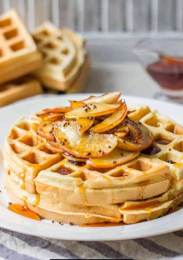 Buttermilk Waffles on a plate with sliced apples